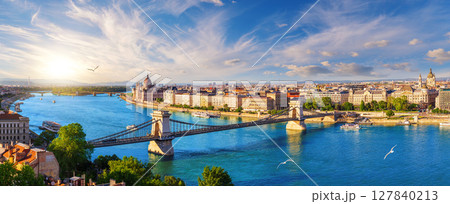 Panoramic view of famous Chain Bridge and Budapest landmark at sunset over Danube river 127840213