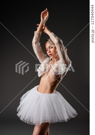 Beauty in motion as a woman dances in lingerie within a studio setting Beauty in motion as a woman dances in lingerie within a studio setting 127840444