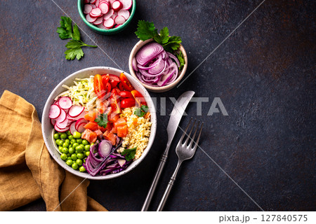 Balanced healthy bowl with vegetables and salmon 127840575