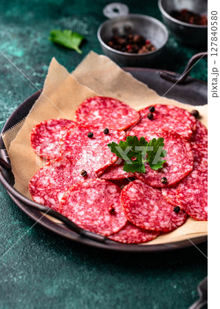 Sliced spicy tasty salami sausage Sliced spicy tasty salami sausage 127840580