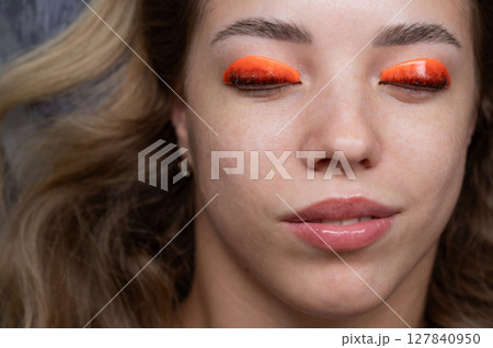 Caucasian woman undergoing eyelash lamination procedure. top view.  127840950
