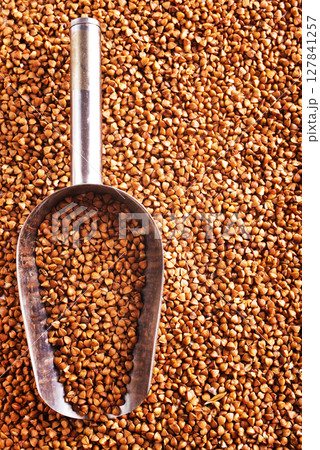 Close up raw buckwheat background. Close up raw buckwheat background. 127841257