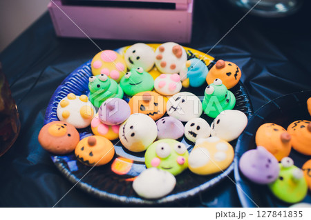A beautiful array of Colorful Halloween Themed Cookies beautifully arranged on a Plate A beautiful array of Colorful Halloween Themed Cookies beautifully arranged on a Plate 127841835