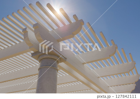 Detail Abstract of A Beautiful Marble and Wood Pergola Patio Cover. 127842111