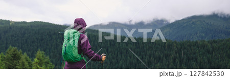 Woman enjoy the rainy forest in summer high altitude mountains Woman enjoy the rainy forest in summer high altitude mountains 127842530