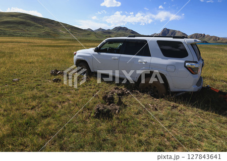 Offroad car got stuck in the mud 127843641