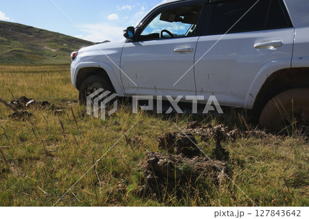Offroad car got stuck in the mud Offroad car got stuck in the mud 127843642