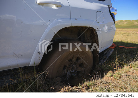 Offroad car got stuck in the mud Offroad car got stuck in the mud 127843643