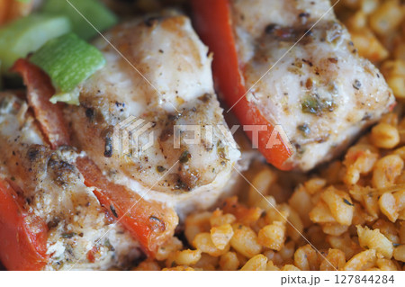 Grilled Chicken Skewers with Spiced Bulgur Wheat and Vegetables 127844284