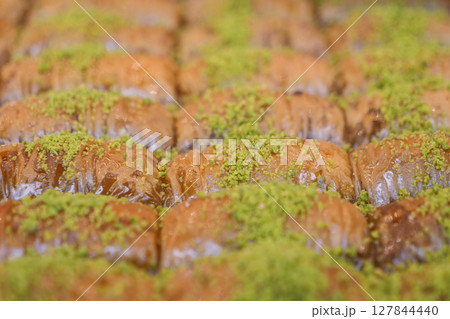 Enjoy the mouthwatering and delicious Baklava Slices that come with a delightful Pistachio Topping Enjoy the mouthwatering and delicious Baklava Slices that come with a delightful Pistachio Topping 127844440
