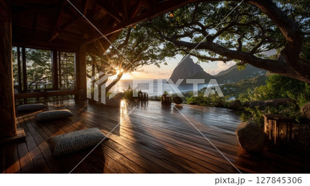 Sunrise Over Tropical Island Ocean View from Wooden Deck Sunrise Over Tropical Island Ocean View from Wooden Deck 127845306