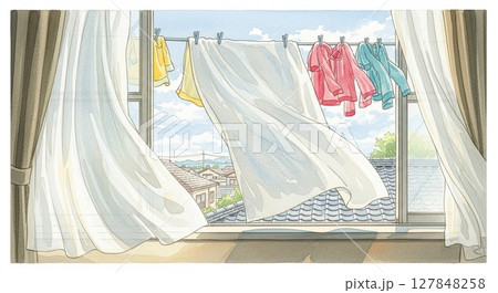 洗濯物越しに望む穏やかな夏空と街並み 127848258