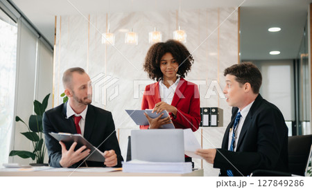 Young business creative team are brainstorming planning discussing while sitting in creative business discussing work in the office Young business creative team are brainstorming planning discussing while sitting in creative business discussing work in the office 127849286