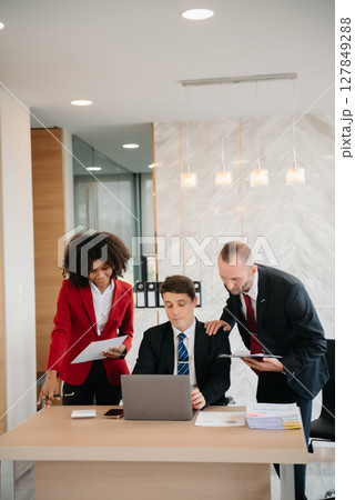 Young business creative team are brainstorming planning discussing while sitting in creative business discussing work in the office 127849288