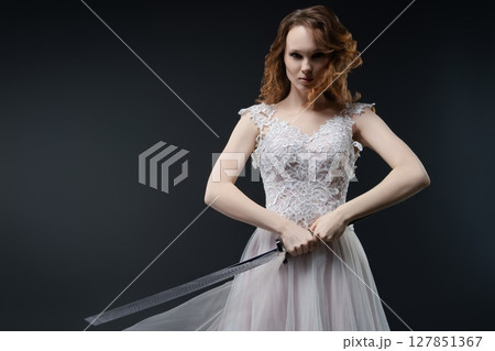 Bold bride exuding beauty and strength in delicate lingerie-inspired gown Bold bride exuding beauty and strength in delicate lingerie-inspired gown 127851367