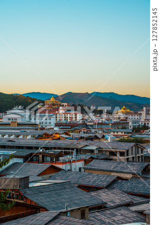 Shangri-La Cityscape with Mountain Valley at Dramatic Sunset Shangri-La Cityscape with Mountain Valley at Dramatic Sunset 127852145