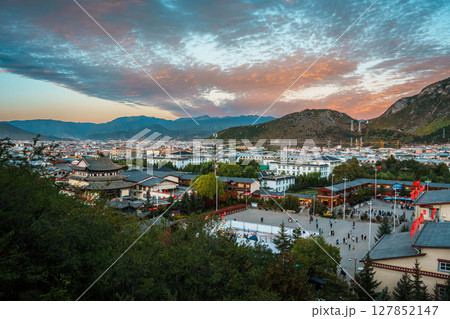 Shangri-La Cityscape with Mountain Valley at Dramatic Sunset Shangri-La Cityscape with Mountain Valley at Dramatic Sunset 127852147