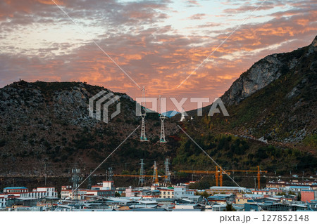 Shangri-La Cityscape with Mountain Valley at Dramatic Sunset 127852148