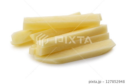 Cut raw potatoes into long strips for making French fries isolated on a white background Cut raw potatoes into long strips for making French fries isolated on a white background 127852948