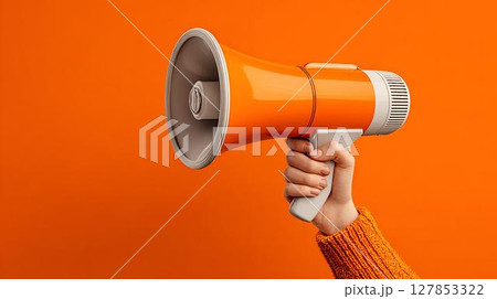 hand with megaphone on yellow background 127853322