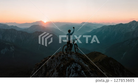 Scenic Mountain Biker on Summit, Triumph, Nature, Healthy Lifestyle. Ideal for sports brands, outdoor activities, fitness, well-being 127853605