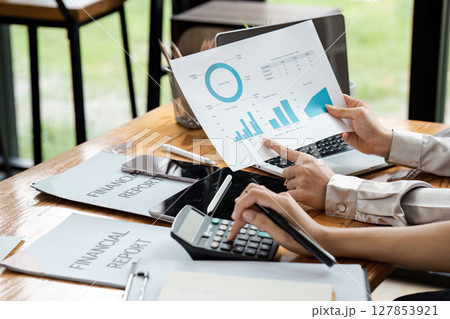 Business team collaboration discussing working analyzing with financial data and marketing growth 127853921