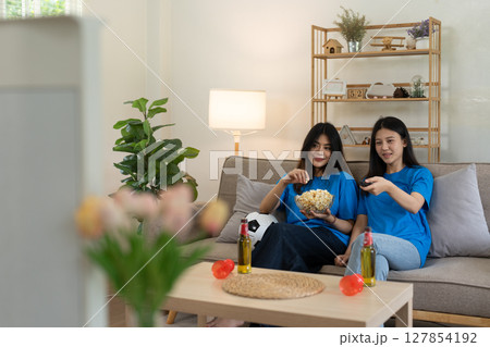 LGBT Soccer fans emotionally watching game in the living room LGBT Soccer fans emotionally watching game in the living room 127854192