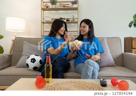 LGBT Soccer fans emotionally watching game in the living room LGBT Soccer fans emotionally watching game in the living room 127854194