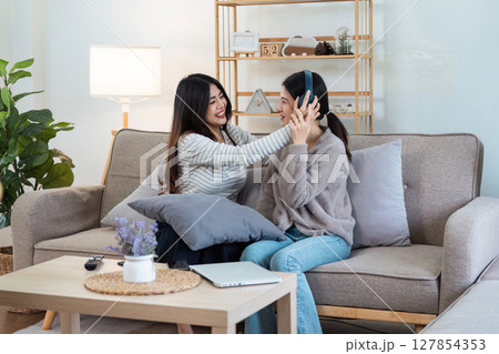 pride month. Happy woman lesbian gay lgbt couple celebrating love together during relax at home. lgbtq couple concept 127854353