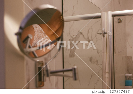 Woman in bathroom with wet slim sexy body taking a shower Woman in bathroom with wet slim sexy body taking a shower 127857457