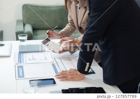 Asian business people working as a good team in the office. Successful teamwork in a meeting, workplace concept. Asian business people working as a good team in the office. Successful teamwork in a meeting, workplace concept. 127857789