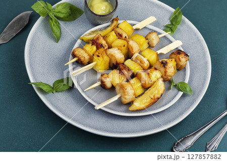 Roasted or fried scallops with pineapple pieces Roasted or fried scallops with pineapple pieces 127857882