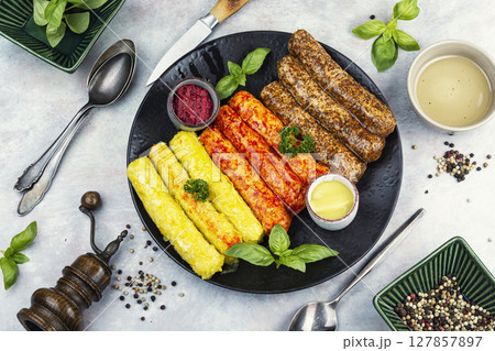 Delicious, uncooked sausages. 127857897