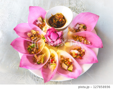 The famous Thai food "Miang Kham" consists of various herbal ingredients in lotus flowers. 127858936