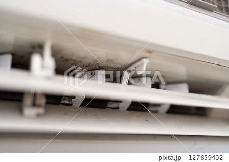 Mold on air conditioner close-up. Air conditioner maintenance and cleaning. 127859432