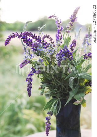 bouquet of sage on the table in the summer garden bouquet of sage on the table in the summer garden 127860322