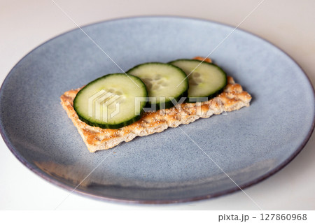 Crispbread with cucumbers on a plate Crispbread with cucumbers on a plate 127860968