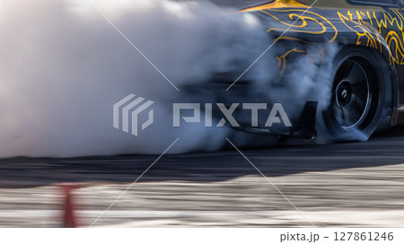 Car drifting, Blurred image diffusion race drift car with lots of smoke from burning tires on speed track, Car drifting on speed track, Professional driver driv drifting car. Car drifting, Blurred image diffusion race drift car with lots of smoke from burning tires on speed track, Car drifting on speed track, Professional driver driv drifting car. 127861246