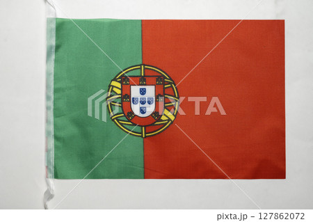 Closeup view of the Portugal national flag isolated over a white background. Concept of government and nationality Closeup view of the Portugal national flag isolated over a white background. Concept of government and nationality 127862072