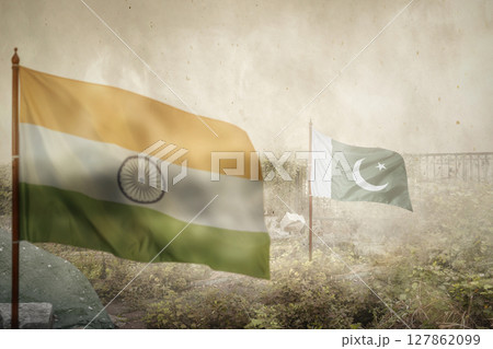 India and Pakistan flags with an inferno landscape background. Pakistan vs India military war conflict. Weapon of a nuclear missile battle India and Pakistan flags with an inferno landscape background. Pakistan vs India military war conflict. Weapon of a nuclear missile battle 127862099