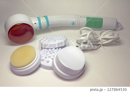 massager with infrared heating. handheld device for body and face massage, with interchangeable attachments for different purposes 127864530