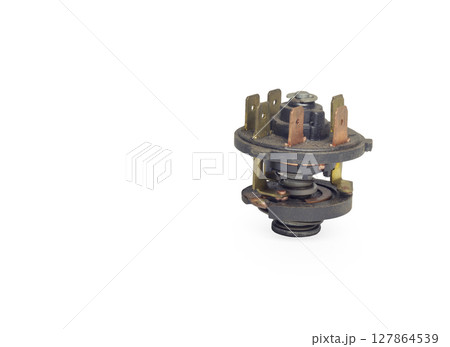 ignition starter switch, key operated, inners without housing, perforated contacts set. isolated on white background ignition starter switch, key operated, inners without housing, perforated contacts set. isolated on white background 127864539