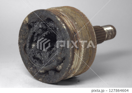 constant velocity joint of front wheel drive car, dismantlet for replacing, dirty, worn, with clipping path constant velocity joint of front wheel drive car, dismantlet for replacing, dirty, worn, with clipping path 127864604