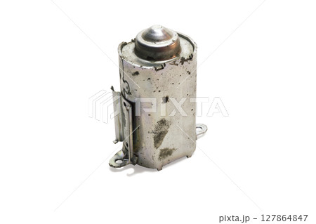 motor housing of disassembled rear windshield wiper motor. piece, that covers armature, metal, on white background, with clipping path 127864847