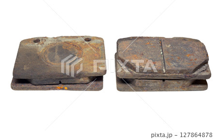 Set of old worn and rusty brake pads, dismantled from car. isolated on white background Set of old worn and rusty brake pads, dismantled from car. isolated on white background 127864878