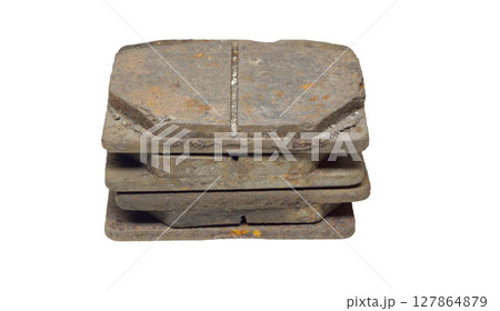Pile of worn brake pads, dismantled from car. isolated on white background 127864879