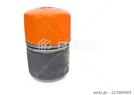 full flow oil filter piled, contacts by ends with holes for supply and outlet of engine oil so only solid metal case with rim visible. isolated on white background, with clipping path 127864901