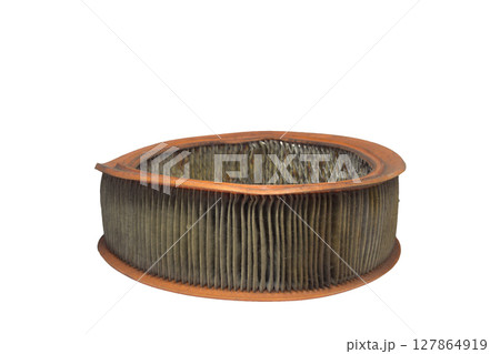 engine round air filter, with clogged up paper media. old, dusty and worn, isolated on white background 127864919