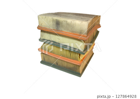 engine air filters neat stack, rectangular, with soft seal on rubber edge. Paper filter, dusty, worn, crumpled when replacing, isolated on white background engine air filters neat stack, rectangular, with soft seal on rubber edge. Paper filter, dusty, worn, crumpled when replacing, isolated on white background 127864928
