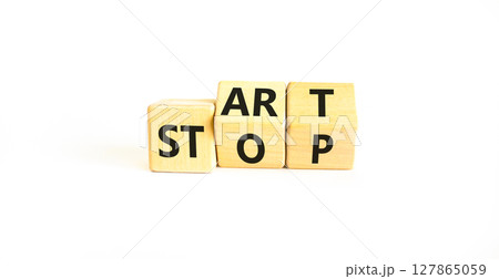 Start or stop symbol. Concept words Start or Stop on beautiful wooden block. Beautiful white table white background. Business start or stop concept. Copy space. Start or stop symbol. Concept words Start or Stop on beautiful wooden block. Beautiful white table white background. Business start or stop concept. Copy space. 127865059